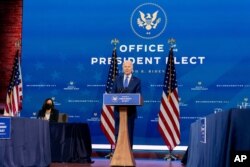 FILE - President-elect Joe Biden, accompanied by Vice President-elect Kamala Harris, speaks at a news conference to introduce their nominees and appointees to economic policy posts at The Queen theater, Dec. 1, 2020, in Wilmington, Del.