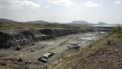 Workers dig an area where a new set of locks of the Panama Canal will be built in Cocoli, near Panama City