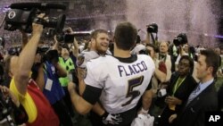 Baltimore Ravens quarterback Joe Flacco (5) and offensive lineman Marshal Yanda (73) celebrate their team's 34-31 win against the San Francisco 49ers in the NFL Super Bowl XLVII football game, Sunday, Feb. 3, 2013, in New Orleans.