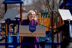 FILE - U.S. First Lady Jill Biden delivers remarks at the playground of the Samuel Smith Elementary School in Burlington, New Jersey, March 15, 2021.