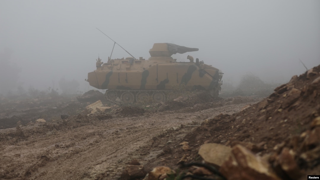 A Turkish military tank is seen near Mount Barsaya, northeast of Afrin, Syria, Jan. 23, 2018. 