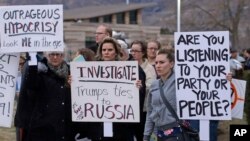 People gather outside the Brighton High School before Rep. Jason Chaffetz's town hall meeting in Cottonwood Heights, Utah, Feb. 9, 2017. In an echo of the raucous complaints that confronted Democrats back in 2009 as they worked to pass "Obamacare" in the first place, Republicans who want to repeal it now are facing angry pushback of their own at constituent gatherings from Utah to Michigan to Tennessee and elsewhere, even in solidly Republican districts.