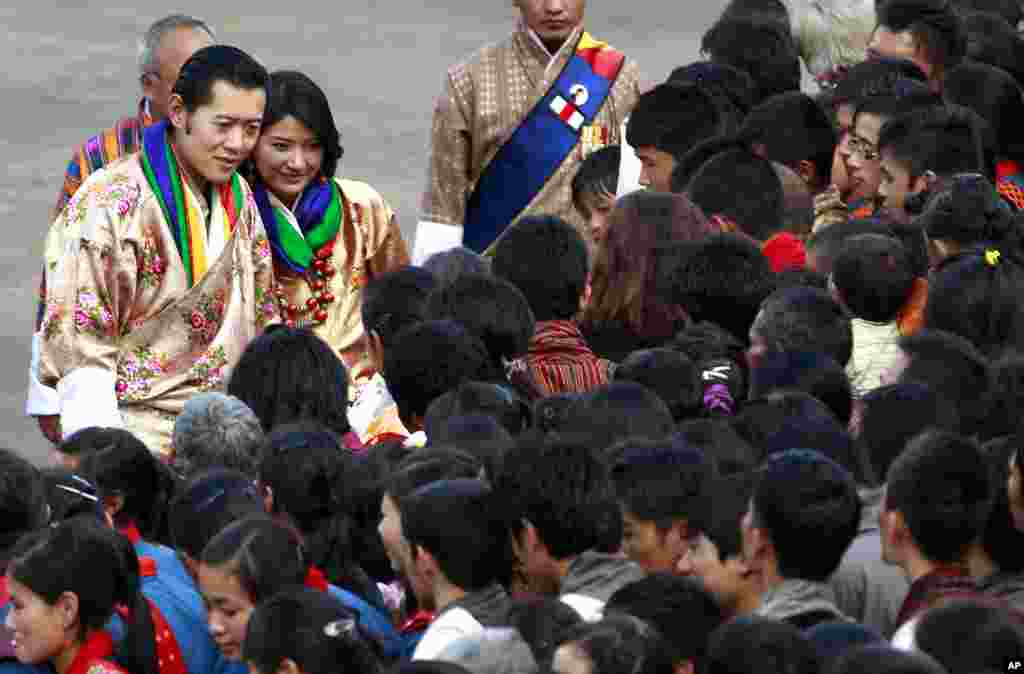 King Jigme Khesar Namgyel Wangchuck and Queen Jetsun Pema meet locals after they were married. (AP)