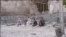 Earthquake victims sit near damaged houses in this undated handout photo taken in an undisclosed location in northwest Iran. Two powerful earthquakes killed 250 people and injured around 1,800 in northwest Iran, where rescue workers frantically combed the