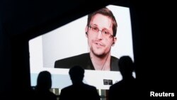 Edward Snowden speaks via video link during the Estoril Conferences - Global Challenges, Local Answers in Estoril, Portugal, May 30, 2017. 