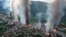 FILE - Fires burn in the town of Thantlang in Myanmar's northwestern state of Chin, Oct. 29, 2021. More than 160 buildings in the town, including three churches, have been destroyed by shelling by government troops. Russia is reportedly the junta's top supplier of weapons.