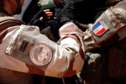 FILE - A close-up of France's Operation Barkhane patch worn by French troops in Africa's Sahel region, in Inaloglog, Mali, October 17, 2017.
