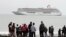 Historic Arctic Cruise: This Aug. 21, 2016, photo shows people preparing to take a polar plunge in the Bering Sea in front of the luxury cruise ship Crystal Serenity, which anchored just outside Nome, Alaska. The ship made a port call as it became the largest cruise ship to ever go through the Northwest Passage, en route to New York City.