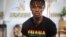 FILE - A LGBT activist wearing a Ghana pride shirt poses for a photo in a safe house, Nov. 8, 2021. Hearings are currently being held on proposed legislation that would make it a crime to be gay, bisexual or transgender in Ghana.