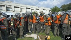 An Israeli soldier role playing as a mock victim lies on the ground during a drill simulating a missile attack in Holon near Tel Aviv November 3, 2011.