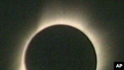 The sun's corona, or outer atmosphere, is visible during totality when the sun is totally obscured by the moon's shadow, 28 Mar 2008