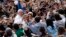 Pope Francis waves as he arrives to lead a weekly general audience in Saint Peter's Basilica, at the Vatican, April 3, 2013.