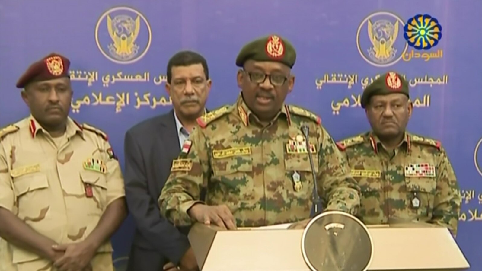  General Jamal Omar, center, a member of Sudan's Transitional Military Council, delivers a speech in Khartoum, July 11, 2019, in this screengrab from a broadcast on Sudan TV.