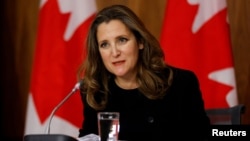 FILE - Canada's Deputy Prime Minister and Minister of Finance Chrystia Freeland speaks to news media in Ottawa, Ontario, Canada, Nov. 30, 2020. 