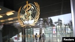 FILE - A logo is pictured outside a building of the World Health Organization (WHO), in Geneva, Switzerland, Feb. 6, 2020.