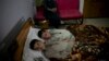 Abdul Rasheed, 9, front, and Shoaib Ahmed, 13, lie in a bed at a hospital in Islamabad, Pakistan, May 5, 2016. The boys are normal active children during the day, but lapse into a vegetative state — unable to move or talk - once the sun goes down.