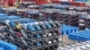 Cars are stacked ready to be loaded onto a ship for export at the port in Taicang, in China’s eastern Jiangsu province on July 16, 2024.