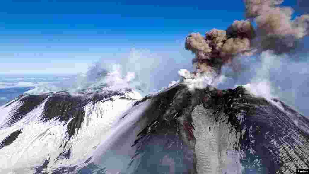 Volcanic steam and ashes rise from Mount Etna, Italy, Feb. 12, 2025. 