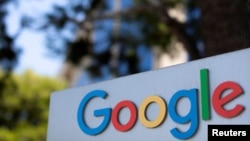 FILE - A Google sign is shown at one of the company's office complexes in Irvine, California.