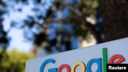 FILE - A Google sign is shown at one of the company's office complexes in Irvine, Calif.