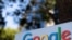 FILE - A Google sign is shown at one of the company's office complexes in Irvine, Calif.
