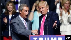 FILE - Aug. 24, 2016 file photo of Republican presidential candidate Donald Trump, right, welcoming pro-Brexit British politician Nigel Farage, to speak at a campaign rally in Jackson, Miss. Britain's vote to leave the European Union was a major shock to the global political system. But in a year of political earthquakes, it has just been trumped. Like Brexit, Donald Trump's victory over Hillary Clinton in the U.S. presidential election was driven by voters turning against established order and mainstream politicians.