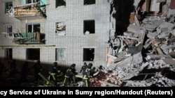 Rescuers work at the site of a residential building hit by a Russian air strike in the village of Svesa in Sumy region, Ukraine, Jan. 4, 2025. (Press service of the State Emergency Service of Ukraine in Sumy region/Handout via Reuters)