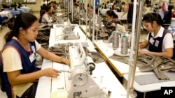 Cambodian garment workers sew clothes in a factory in Phnom Penh.