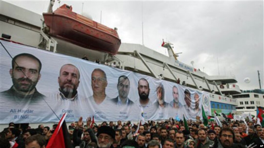 A banner depicting the faces of the nine men killed, displayed on the Mavi Marmara ship, the lead boat of a flotilla headed to the Gaza Strip which was stormed by Israeli naval commandos in a predawn confrontation in the Mediterranean May 31, 2010, on its