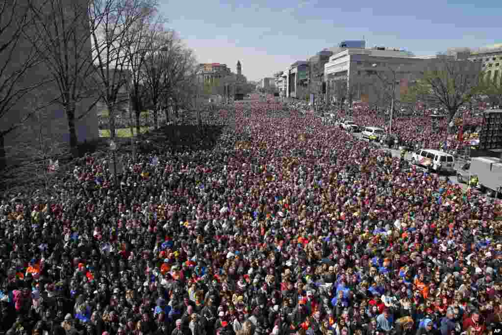 Looking west away from the stage, the crowd fills Pennsylvania Avenue during the &quot;March for Our Lives&quot; rally in support of gun control, March 24, 2018, in Washington. The rally was organized following the mass shooting that killed 17 people at Marjory Stoneman Douglas High School in Parkland, Florida, Feb. 14.