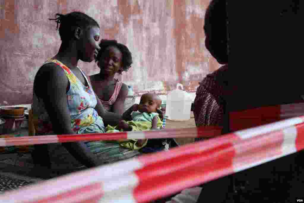 A family squatting at Bossangoa hospital, where over 1000 people have sought refuge from widespread killing, rape and extortion by de facto state forces, Nov. 9, 2013. (Hanna McNeish for VOA)