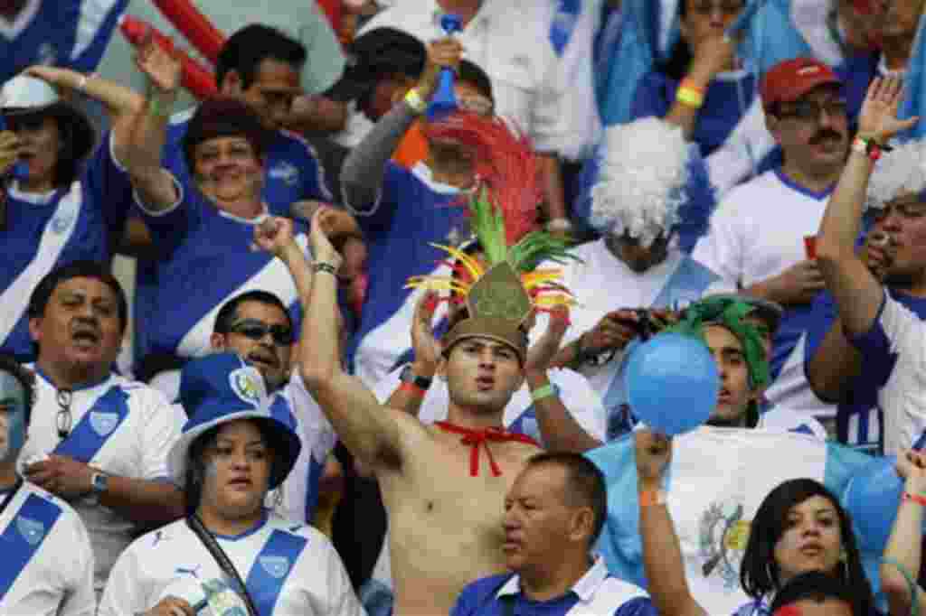Guatemala soccer fans cheer their team in a U-20 World Cup Group D soccer match against Nigeria in Armenia, Colombia, Sunday,July 31, 2011. (AP Photo/Fernando Vergara)