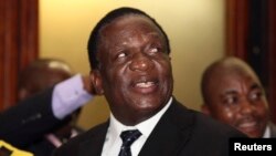 FILE - Zimbabwean Vice President Emmerson Mnangagwa, shown at his party's headquarters in December 2014, has told lawmakers that state officials are not holding activist Itai Dzamara and that law enforcement agencies are searching for him. 