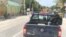 Vehicles are stopped on a highway in Gressiers as armed thugs threaten to target anyone who tries to cross the road. (S. Lemaire/VOA)