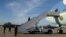 President Donald Trump disembarking from Air Force One at Joint Base Andrews, Maryland, April 9, 2017. (Photo: S. Herman / VOA)