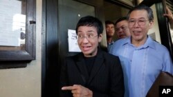 Maria Ressa, head of the Philippine online news site Rappler walks outside the Regional Trial Court branch 46 in Manila, Philippines on March 1, 2019. 