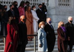 Former U.S. President Bill Clinton and former Secretary of State Hillary Clinton, former U.S. President George W. Bush and Laura Bush, and former U.S. president Barack Obama and Michelle Obama wait at the Arlington National Cemetery, Jan. 20, 2021.