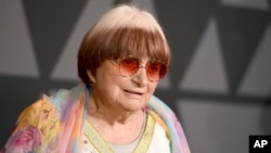 FILE - Filmmaker Agnes Varda arrives at the 9th annual Governors Awards in Los Angeles, Nov. 11, 2017. Varda shares the documentary feature Oscar nomination for “Faces Places” with her co-director, JR, and her producer daughter, Rosalie Varda. She received an honorary Academy Award in November recognizing her decades of filmmaking.
