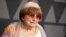 FILE - Filmmaker Agnes Varda arrives at the 9th annual Governors Awards in Los Angeles, Nov. 11, 2017. Varda shares the documentary feature Oscar nomination for “Faces Places” with her co-director, JR, and her producer daughter, Rosalie Varda. She received an honorary Academy Award in November recognizing her decades of filmmaking.