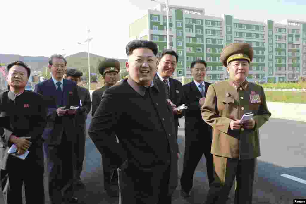 North Korean leader Kim Jong Un arrives at the newly built Wisong Scientists Residential District in this undated photo released by North Korea's Korean Central News Agency (KCNA) in Pyongyang October 14, 2014. 