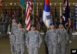 Incoming Commander General of the Eighth U.S. Army, Lt. Gen. Thomas Vandal, second from left, ROK-US Combined Forces Command and U.S. Forces Korea Commander Curtis Scaparrotti, center, and outgoing Commander General of the Eighth U.S. Army, Lt. Gen. Bernard Champoux, second from right, during a change of command ceremony at Yongsan Garrison in Seoul, South Korea, Feb. 2, 2016.