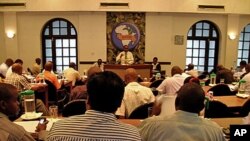 Etiquette in the auction room is strict, with ties required for brokers and collared shirts for buyers, at the Mombasa Tea Auction in Mombasa, Kenya, February 14, 2012.