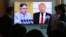People watch a TV screen showing file footage of U.S. President Donald Trump, right, and North Korean leader Kim Jong Un during a news program at the Seoul Railway Station in Seoul, South Korea, April 21, 2018. 