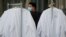 A worker delivers protective lab coats to the headquarters of Moderna Therapeutics, which is developing a vaccine against the coronavirus disease, in Cambridge, Massachusetts, U.S., May 18, 2020. 
