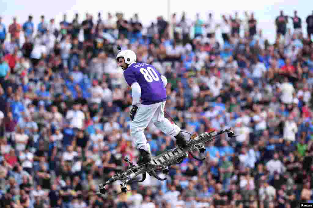 A Fiorentina fan flies with a drone inside the Artemio Franchi stadium in Florence, Italy, April 29, 2018, before the Italian Serie A football match between Fiorentina and Napoli.