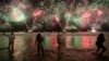 FILE - People celebrate the start of the New Year as fireworks illuminate Copacabana Beach in Rio de Janeiro, Brazil, Jan. 1, 2024. Cities around the world are readying to ring in 2025 with celebrations highlighting local cultures and traditions.