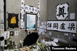 A memorial for a protester who fell to his death is seen at the Legislative Council, a day after protesters broke into the building in Hong Kong, July 2, 2019.