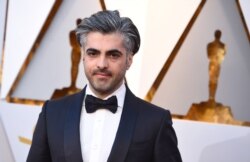 FILE - Feras Fayyad arrives at the Oscars at the Dolby Theatre in Los Angeles, March 4, 2018.