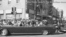 The vehicle carrying President John Kennedy, with a Secret Service agent, riding on the rear bumper, in Dallas, Texas, Nov 22, 1963 (Dallas Times Herald/ The Sixth Floor Museum).