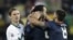 Slovenia's Milivoje Novakovic, left, reacts as United States' Landon Donovan, top center, celebrates with United States' Oguchi Onyewu, second from right, and United States' Clint Dempsey, right, after scoring during the World Cup group C soccer match bet